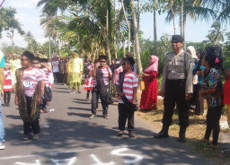 Desa Randu Cangkring Pujer, Gelar Lomba Pawai Antar RT, Dapat Pengawalan Dari Polsek Pujer.
